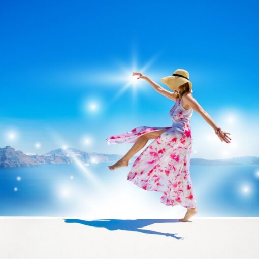 A woman wearing a bright pink dress frolicking on a beach, with sparkles