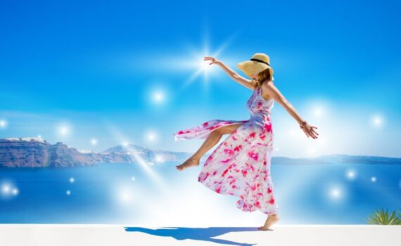 A woman wearing a bright pink dress frolicking on a beach, with sparkles