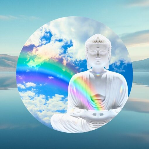 A white, meditative Buddha statue with a rainbow in front a serene lake