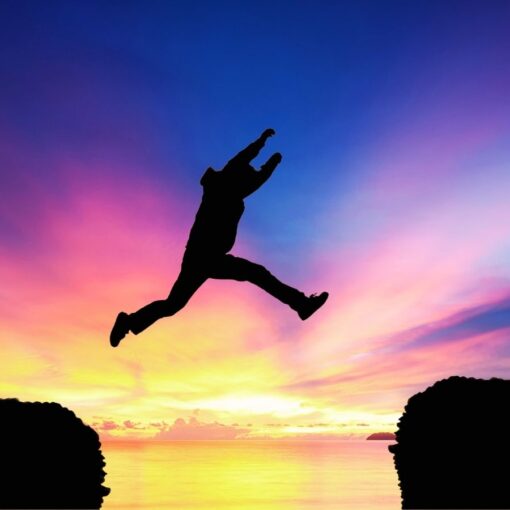 Illustration of a person taking a big leap of faith from one side of a cliff to another